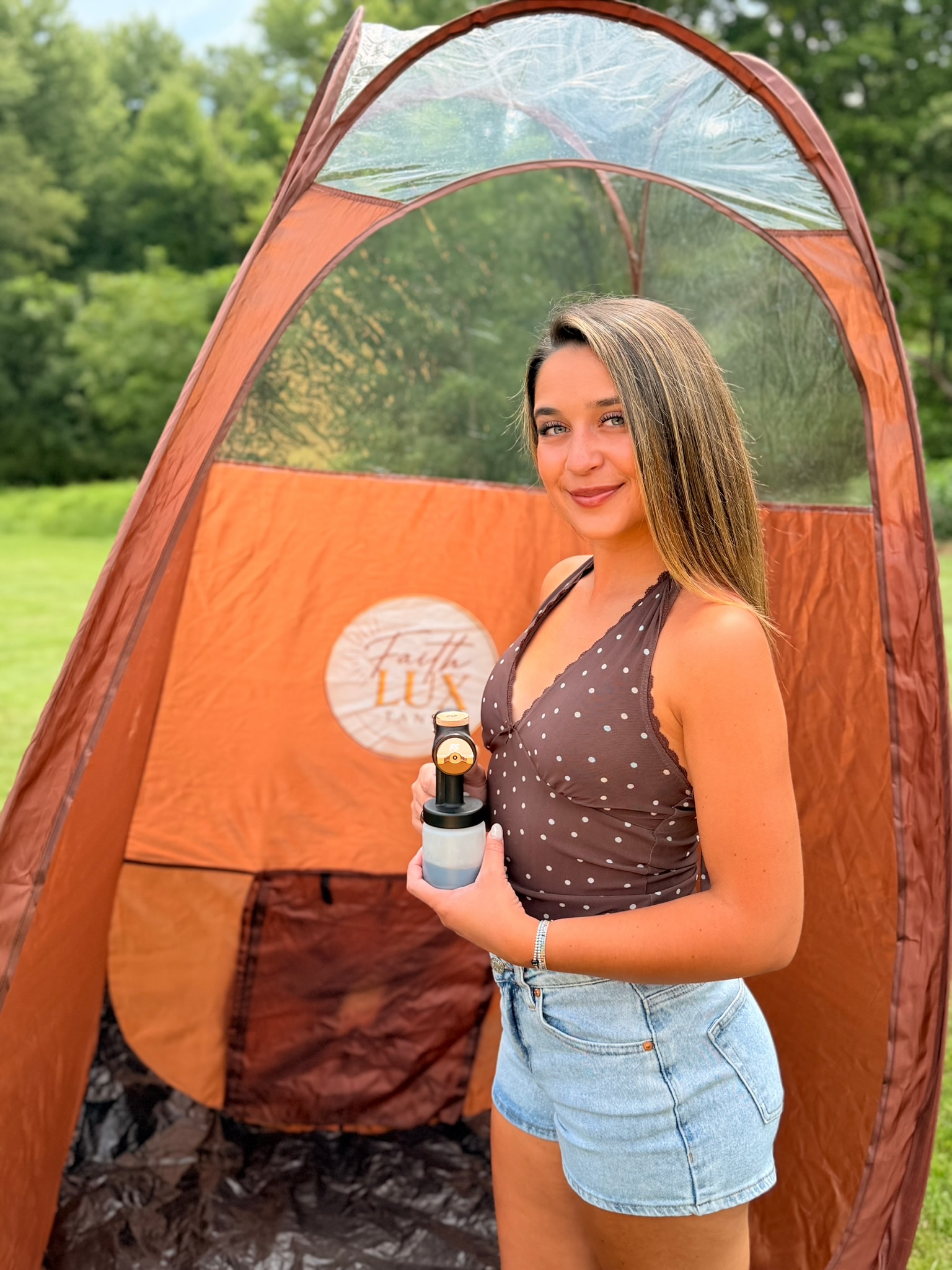 Micah, the artist behind Faith Lux Tans, with her mobile spray tan setup
